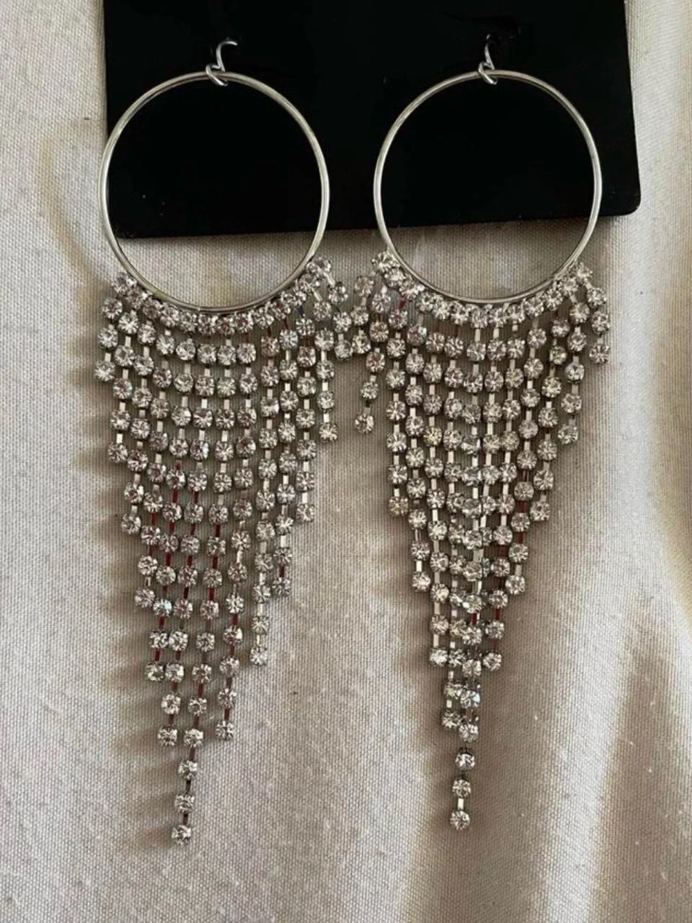 Elegant rhinestone dangling earrings Brand new and never used.